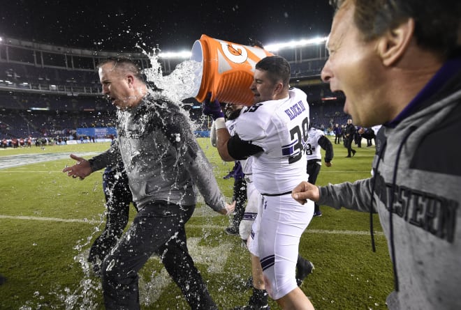 Pat Fitzgerald gets the water shower after NU's win.