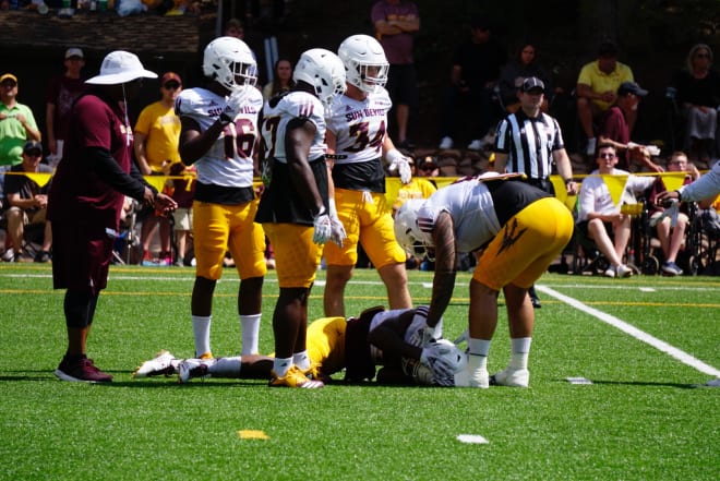 Evan Fields lays on the turf after being undercut during a near interception on Saturday at Camp Tontozona