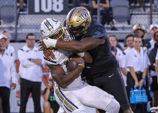UCF's Ricky Barber, right, sacks Georgia Tech's Jeff Sims during a game this season. 