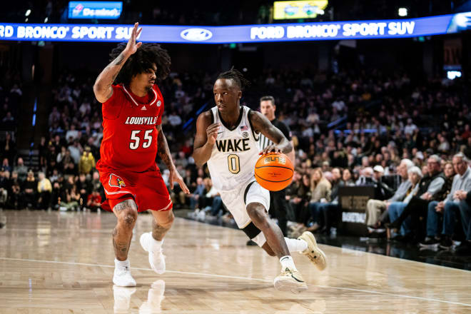 Wake Forest's Kevin Miller drives against Louisville's Skyy Clark on Saturday. 