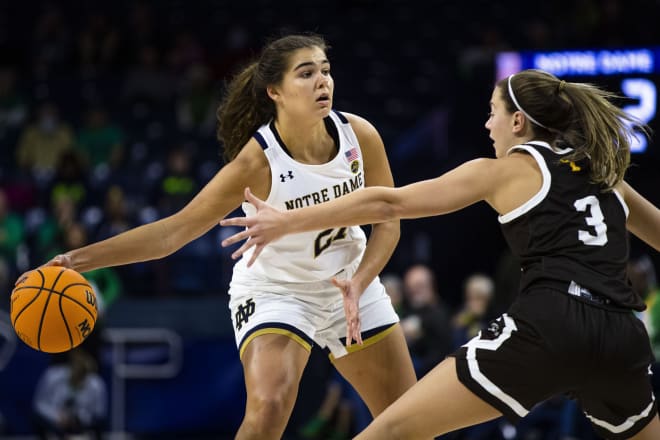 Notre Dame's Maddy Westbeld (21) tries to pass around Western Michigan's Hannah Spitzley (3) during ND's 85-57 victory on Wednesday at Purcell Pavilion.