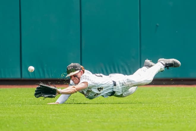 Wake Forest centerfielder Tommy Hawke dives for a ball on Saturday. 