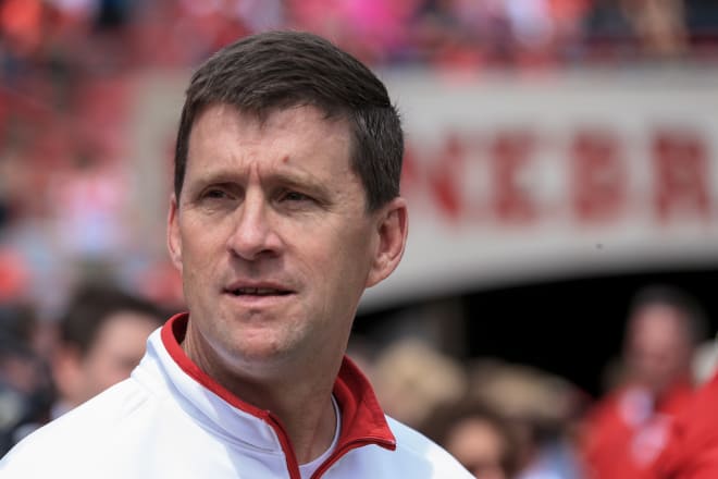 University President Hank Bounds faces the difficult challenge of leading Nebraska's University system through a $50 million budget shortfall. Meanwhile the Athletic Department at NU has never been in a healthier financial state.