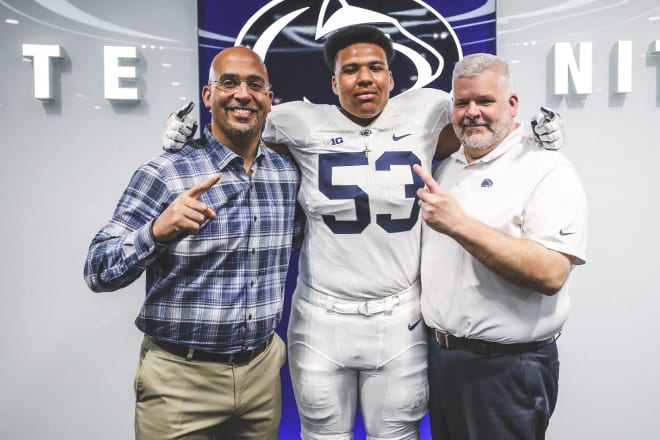 Dawkins poses with Penn State head coach James Franklin and offensive line coach Matt Limegrover during a recruiting visit.