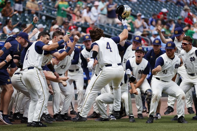 Notre Dame first baseman Carter Putz (4) celebrates his solo home run in the firth inning with his Irish teammates.