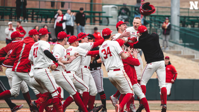 Husker baseball team celebrates after Griffin Everitt hits the walk-off run