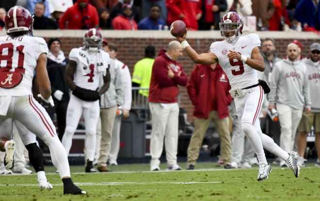 Alabama quarterback Bryce Young (9) scrambles and completes a pass to Alabama tight end Cameron Latu (81) to convert a third down play against Ole Miss at Vaught-Hemingway Stadium. Photo | Gary Cosby Jr.-USA TODAY Sports