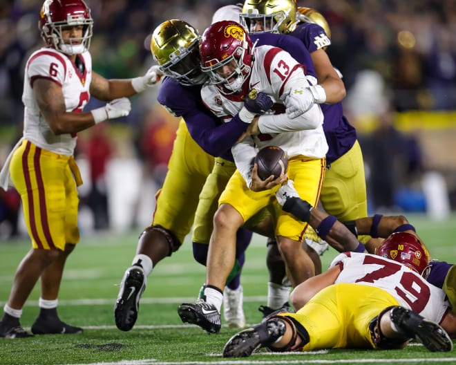 Notre Dame linebacker Jaylen Sneed wraps up USC quarterback Caleb Williams during ND's 48-20 rout of USC on Oct. 14.