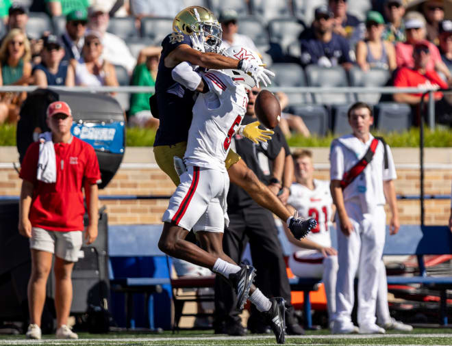 Notre Dame wide receiver Jordan Faison (left) tries to make a play on a well-defended, underthrown pass Saturday against Miami (Ohio).