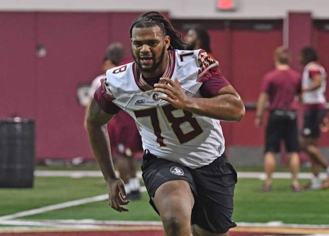 Offensive lineman Ira Henry runs through conditioning drills during his time at FSU.