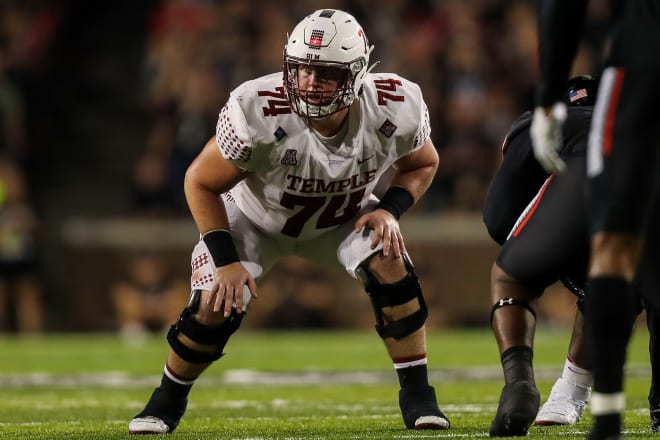 Adam Klein takes a snap at right tackle during a game last season at Cincinnati.