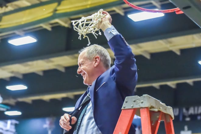 Vermont coach John Becker celebrates after his team won the America East for the third straight season. 