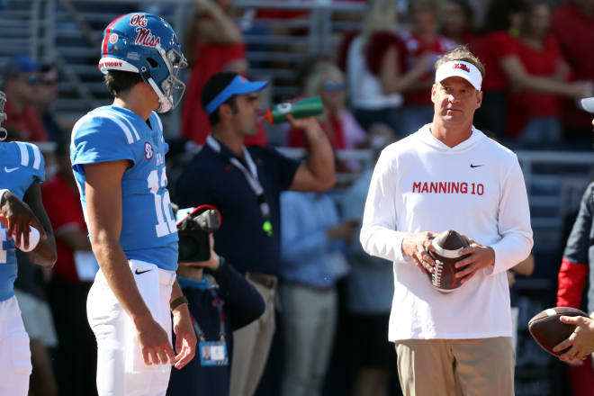 Ole Miss Rebels head coach Lane Kiffin talks with Mississippi Rebels quarterback Kinkead Dent (12) prior to the game against the LSU Tigers at Vaught-Hemingway Stadium. Mandatory Credit: Petre Thomas-USA TODAY Sports