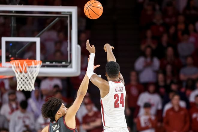 Alabama forward Brandon Miller (24) shoots for three as Oklahoma forward Jalen Hill (1) jumps to block in the first half during a basketball game between The Oklahoma Sooners (OU) and The Alabama Crimson Tide at the Lloyd Noble Center in Norman, Okla. Photo | NATHAN J. FISH/THE OKLAHOMAN / USA TODAY NETWORK