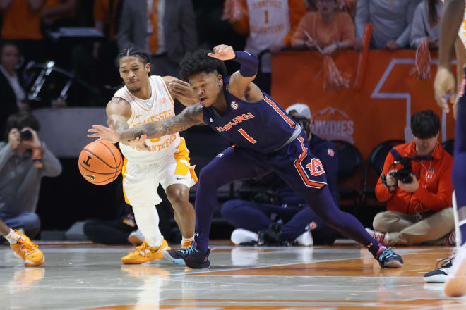 Tennessee guard Zakai Zeigler (5) pokes the ball loose from Auburn guard Wendell Green Jr. (1) in the first half.