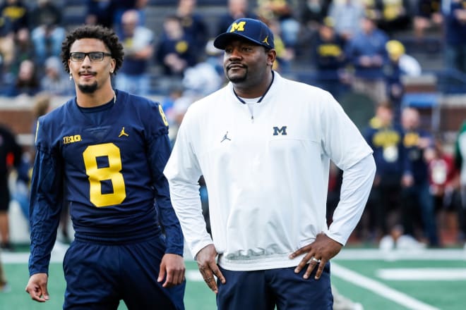 Michigan Wolverines football receiver Ronnie Bell and assistant coach Ron Bellamy