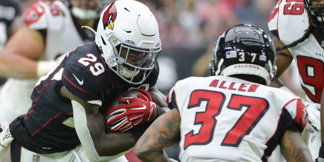 Arizona Cardinals running back Chase Edmonds (29) runs the ball as Atlanta Falcons free safety Ricardo Allen (37) defends during the first half at State Farm Stadium.