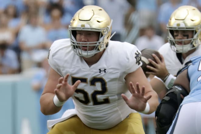 Notre Dame center Zeke Correll (52) continues to strive for better consistency and a bigger body.