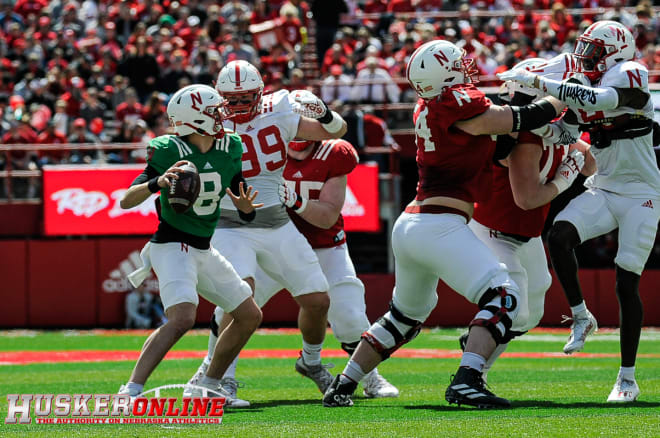 Nebraska defensive lineman Ty Robinson puts pressure on quarterback Logan Smothers