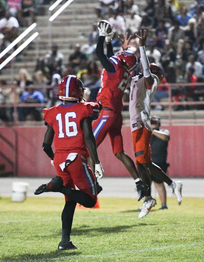 Pine Forest's Xavier Thompson (No. 20) intercepts a pass versus Escambia 