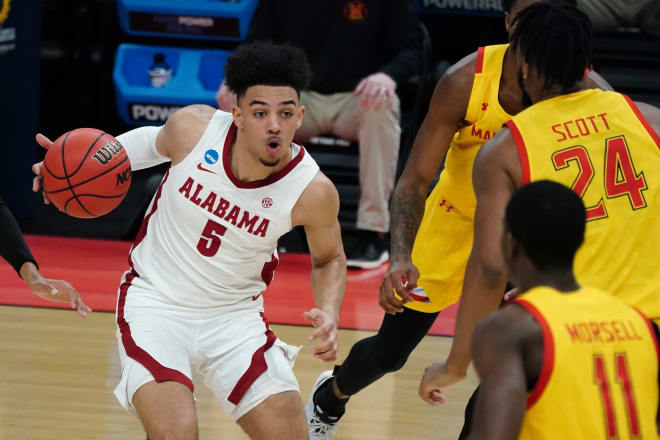 Alabama Crimson Tide guard Jaden Shackelford (5) drives against Maryland Terrapins forward Donta Scott (24) in the first half in the second round of the 2021 NCAA Tournament at Bankers Life Fieldhouse. Photo | Alabama Athletics