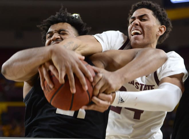 Evan Battey battles ASU' Jalen Graham during a game in Tempe on Jan. 16, 2020