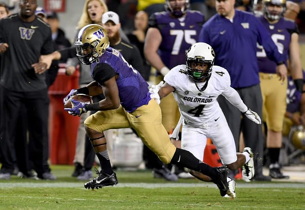 SANTA CLARA, CA - DECEMBER 02: John Ross #1 of the Washington Huskies gets past Chidobe Awuzie #4 of the Colorado Buffaloes on his way to scoring a touchdown during the Pac-12 Championship game at Levi's Stadium on December 2, 2016 in Santa Clara, California. (Photo by Thearon W. Henderson/Getty Images)