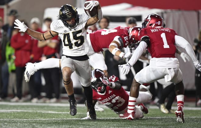 Bloomington, Indiana, USA; Purdue Boilermakers running back Devin Mockobee (45) runs the ball against the Indiana Hoosiers during the second half at Memorial Stadium. Marc Lebryk-USA TODAY Sports