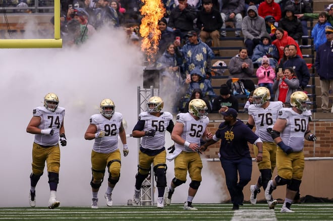 Irish defensive line coach Al Washington and the Gold team take the field for the 2023 Blue-Gold Game.