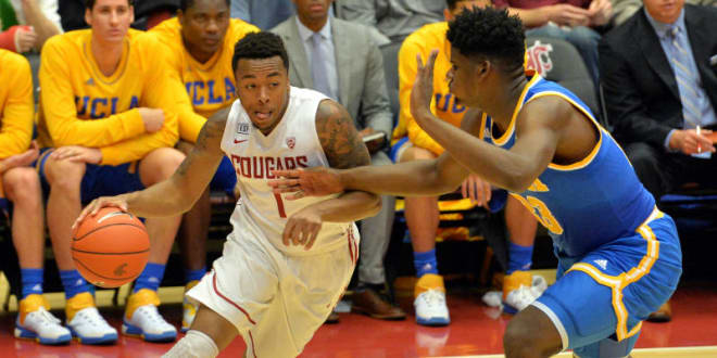 WSU guard Renard Suggs drives on a UCLA defender in Sunday night's win by the Cougars
