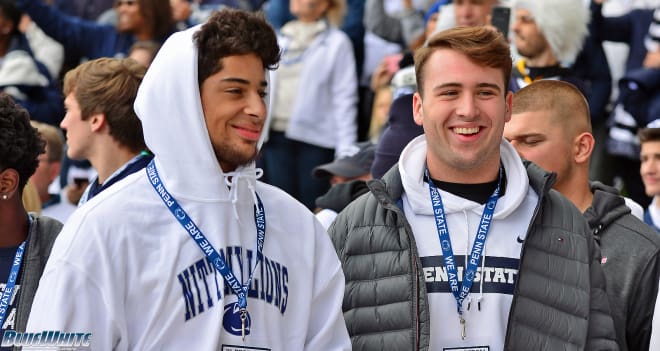 Lewis (left) and OL Alex Atcavage before the game against Michigan State in October. 