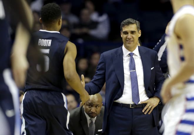 A pleased Jay Wright greets Phil Booth