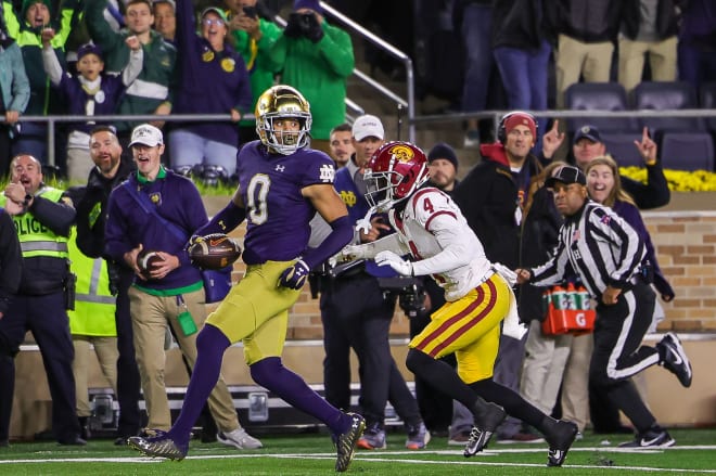 Irish safety Xavier Watts (0) puts the finishing touches on ND's 48-20 romp over USC with a fumble return for a TD.
