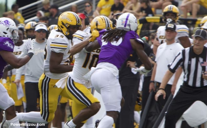 Miller (#10) provides a block for his teammate. 