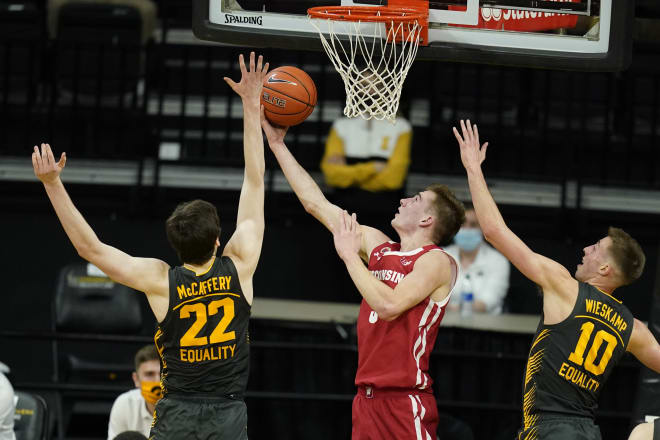 Sophomore Tyler Wahl goes up for a reverse layup over Joe Wieskamp and Patrick McCaffery 