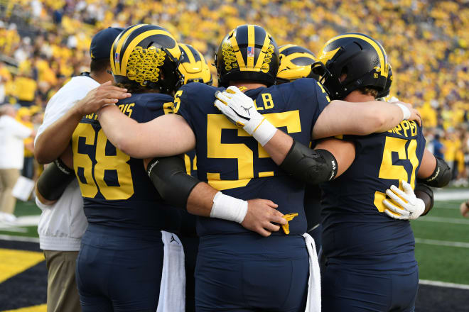 Michigan Wolverines football's offensive line paved the way for a 343-rushing yard performance against Washington.