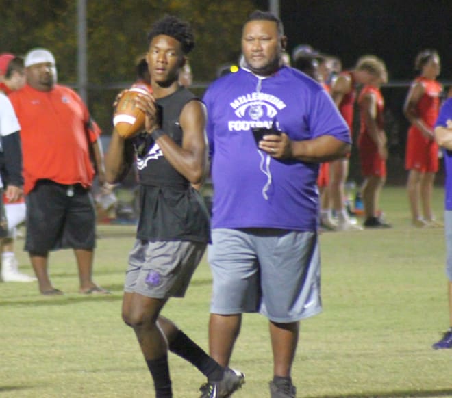 Senior Zareq Brown prepares to throw a pass under the watchful eye of offensive coordinator Ken Suesue in the West Side Passing Tournament last month in Peoria.  Brown passed for 1,063 yards and 13 TDs as a junior.