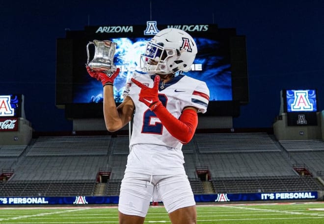 Chance Harrison poses with the Territorial Cup during a June official visit to Arizona.