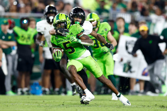 Nov 26, 2022; Tampa, Florida, USA; South Florida Bulls wide receiver Jimmy Horn Jr. (5) runs with the ball against the UCF Knights during the fourth quarter at Raymond James Stadium. 