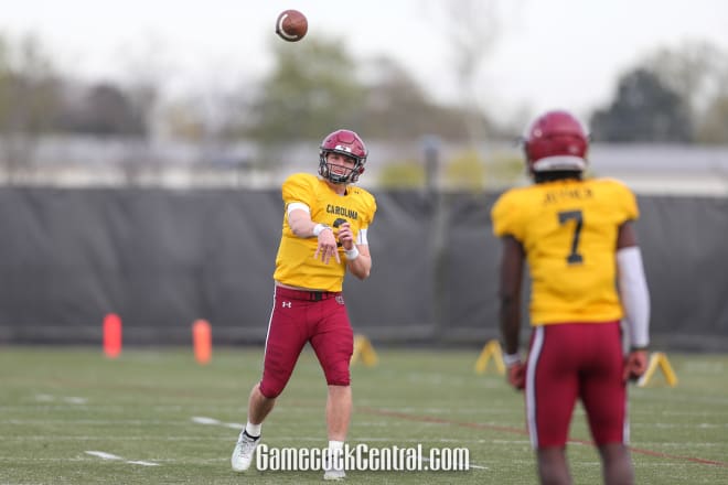 South Carolina quarterback Ryan Hilinski throws to former quarterback Dakereon Joyner in practice.