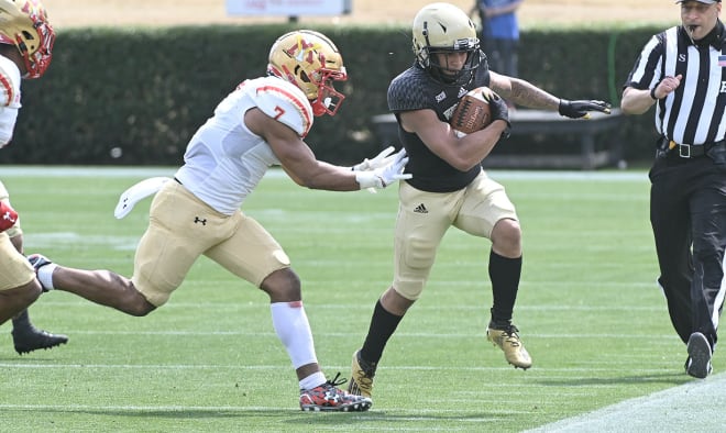 VMI defensive back Josh Sarratt (7), who announced his decision to transfer to James Madison, pushes a Wofford ball-carrier out of bounce during the Keydets' win in March in Spartanburg, S.C.