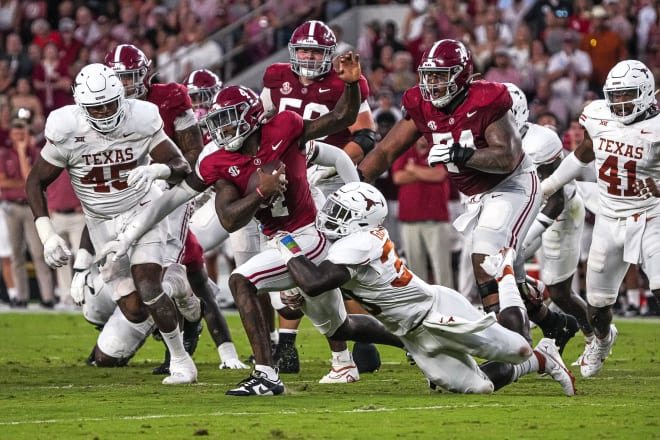 Alabama quarterback Jalen Milroe (4) is sacked by Texas Longhorns linebacker David Gbenda (3) during the game at Bryant-Denny Stadium on Saturday. Photo | Aaron E. Martinez/American-Statesman / USA TODAY NETWORK