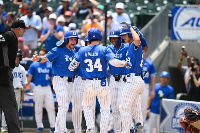 Ben Miller is congratulated after hitting a grand slam against Florida State. 