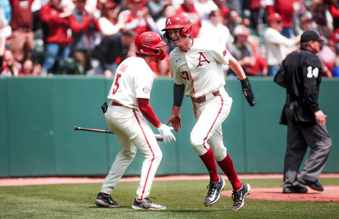 Brady Slavens celebrates a run during the Razorbacks' 8-7 victory over Texas A&M on Saturday.