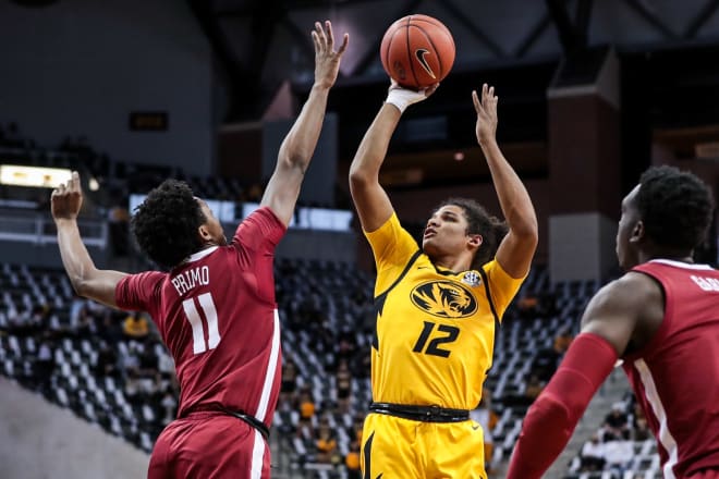 Missouri guard Dru Smith shoots over Alabama guard Joshua Primo. Photo | SEC 