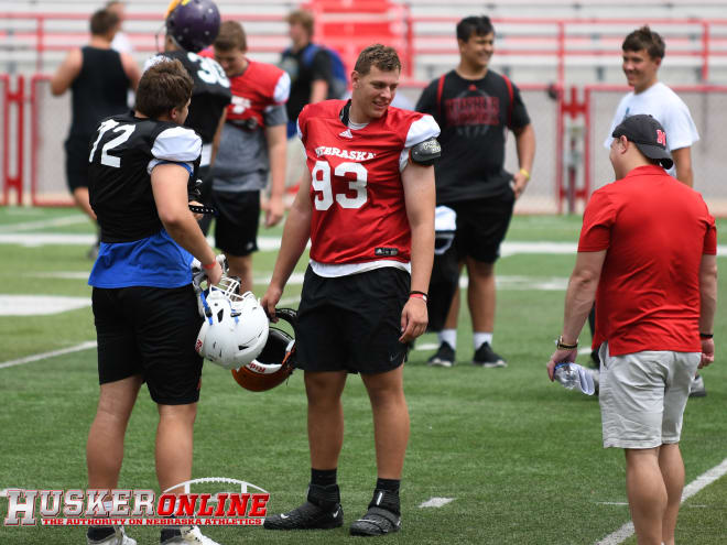 Creighton Prep's Sam Sledge talks with Erie (Colo.) lineman John Pastore after the Pipeline Camp ended. 