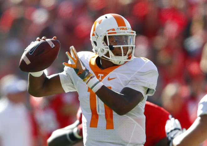 Tennessee quarterback Joshua Dobbs (11) throws from the pocket in the first half of an NCAA college football game against Georgia Saturday, Oct. 1, 2016, in Athens, Ga. (AP Photo/John Bazemore)