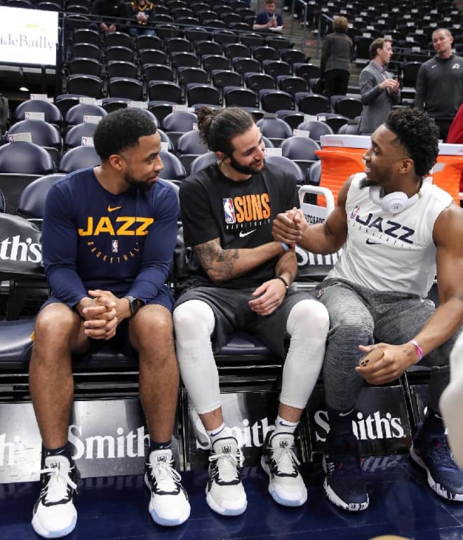 Johnnie Bryant (left), with Phoenix Suns guard Ricky Rubio (center) and Utah Jazz guard Donovan Mitchell (right)