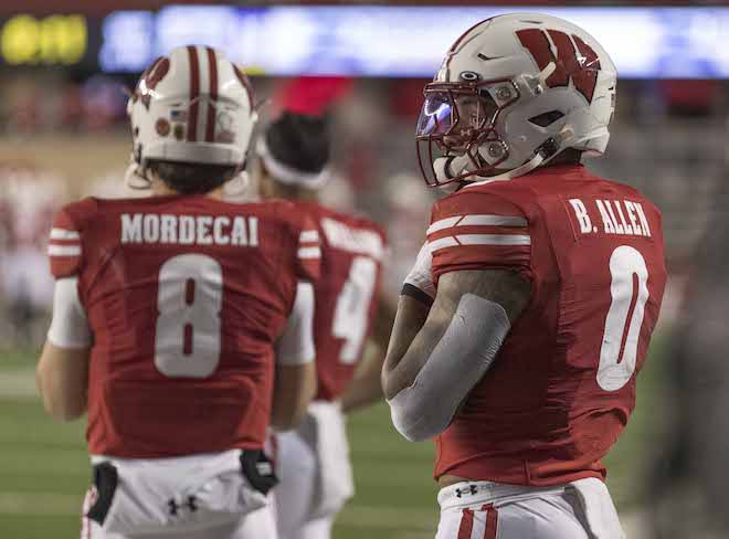 Tanner Mordecai and Braelon Allen look on as the game slips out of reach for Wisconsin. 