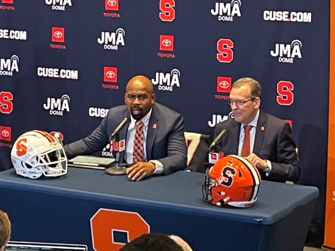 Dec 4, 2023; Syracuse, New York, USA; Syracuse Orange head coach Fran Brown (L) and athletics director John Wildhack (R) discuss Syracuse football's future. Mandatory Credit: Brett Gustin-The Juice Online.